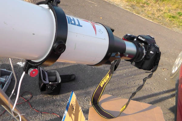 DSLR attached to a telescope via mounting ring